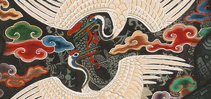 Detailed embroidery of two white cranes and colorful clouds on a dark silk traditional Korean robe, Joseon Dynasty.